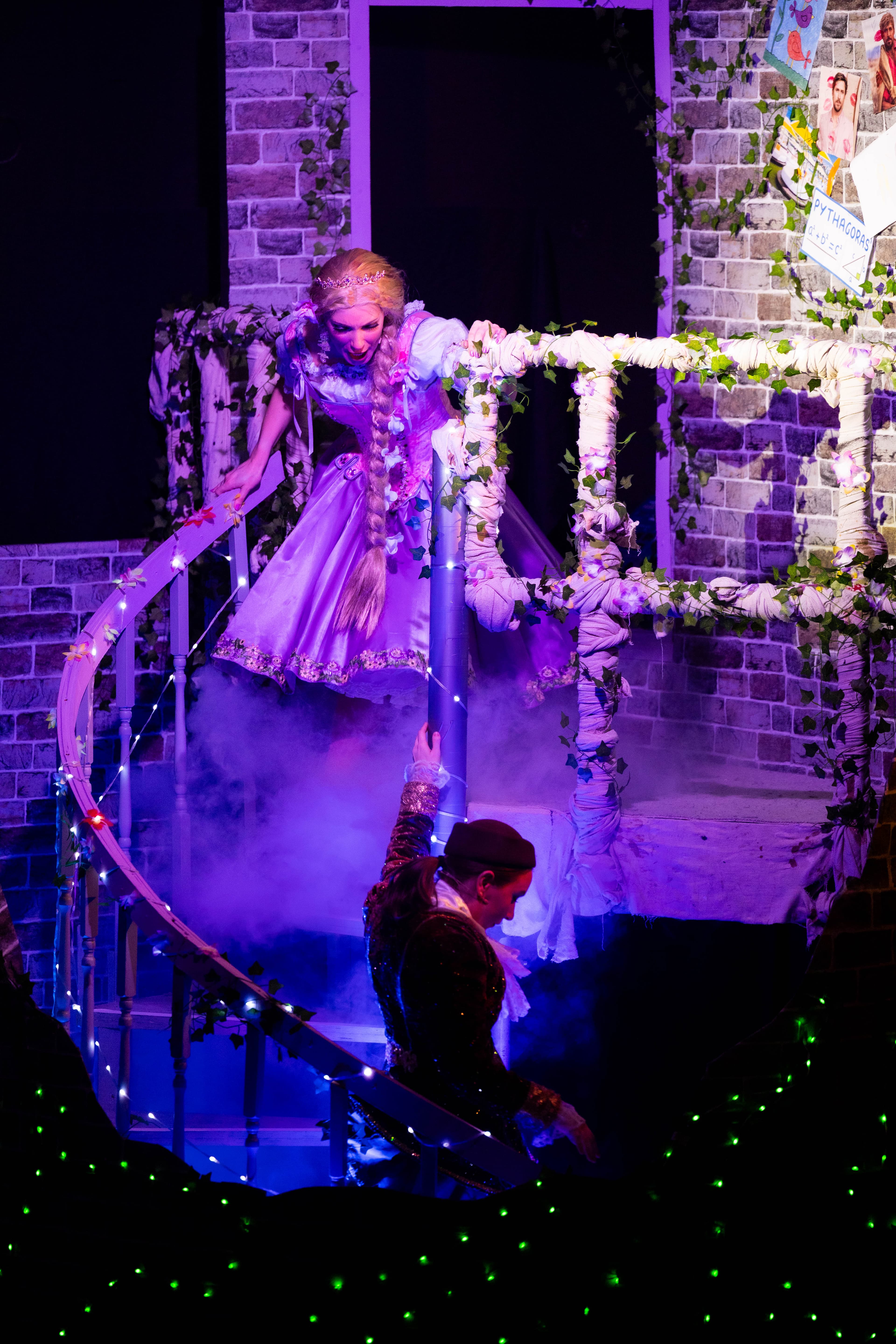 Rapunzel chases Jack down the steps of the tower, through the glowing blue cloud of low fog. The Ivy and handtail are sparkling with LEDs.
